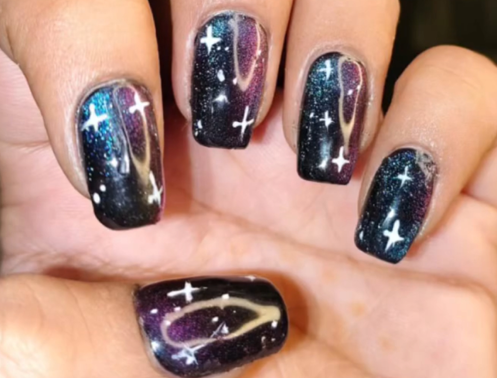 Galaxy-themed nail art design