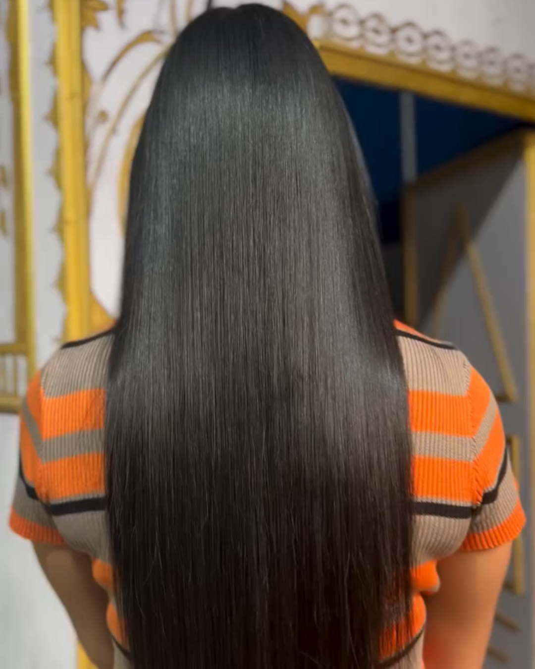 Long, straight, shiny black hair.